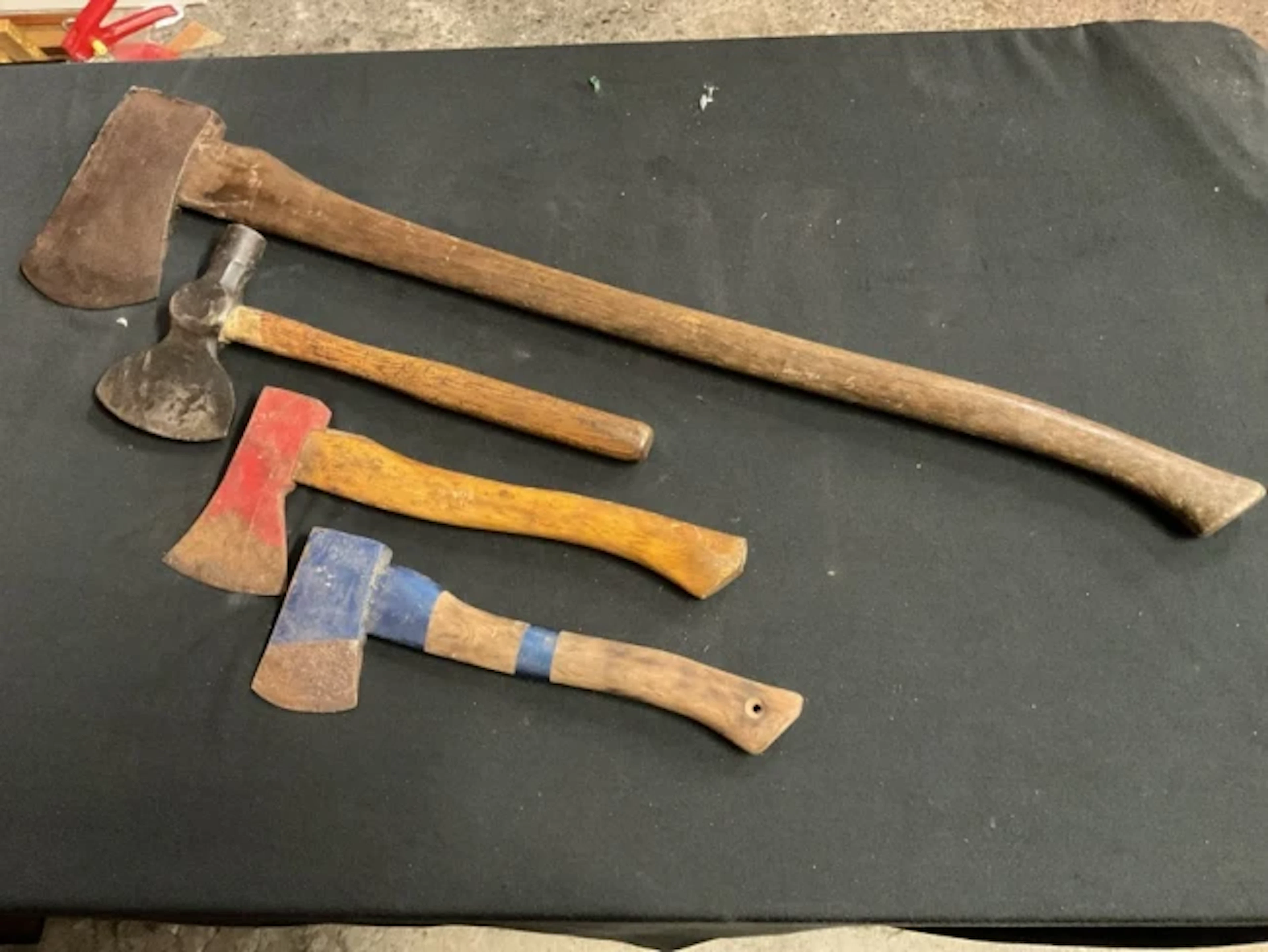 An antique hand forged bricklayers hatchet with oak handle; a large