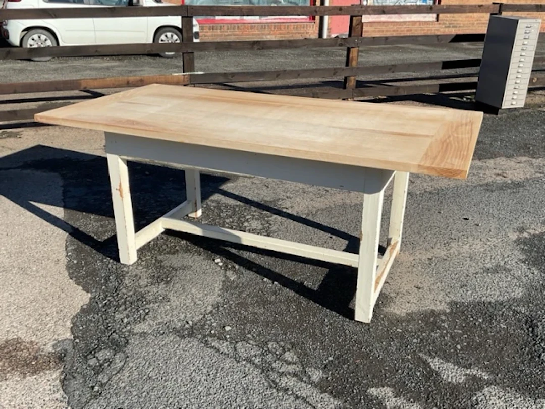 A painted kitchen table with an associated rectangular cleated elm
