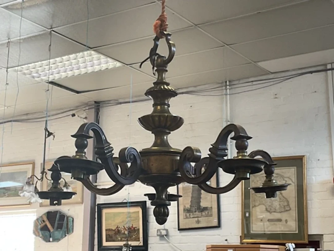 A William & Mary style gilt brass chandelier with scrolled suspension