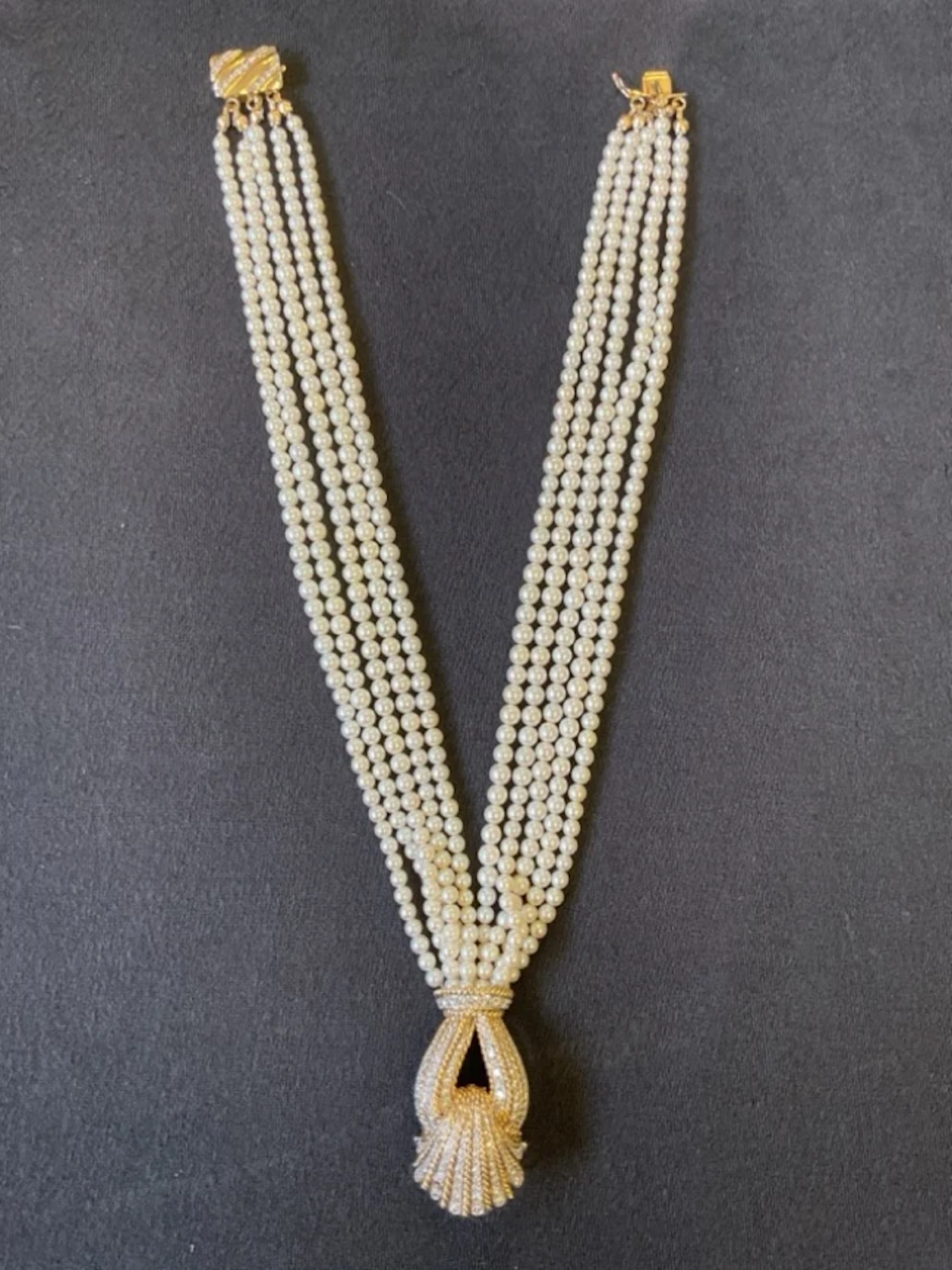 A 14ct gold necklace with tassel-shaped pendant set with brilliant-cut