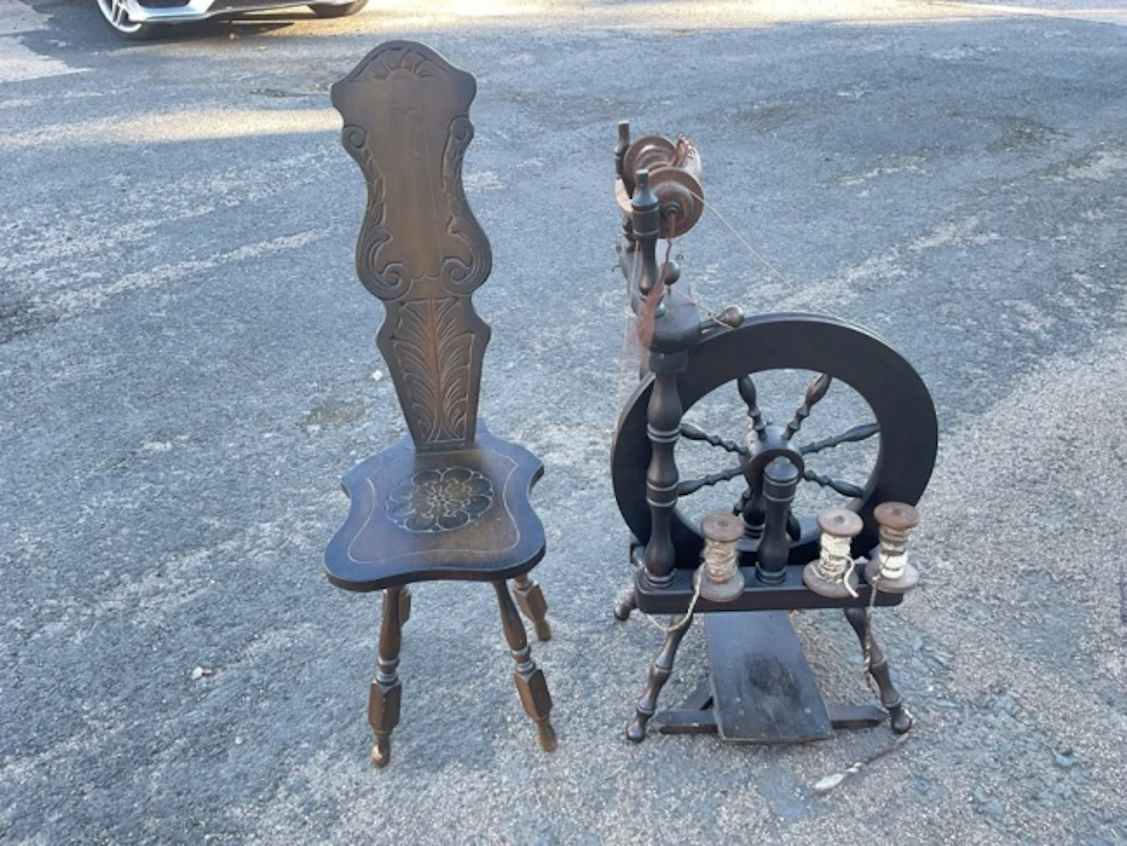 A stained spinning wheel & chair, the seat with scroll carved back