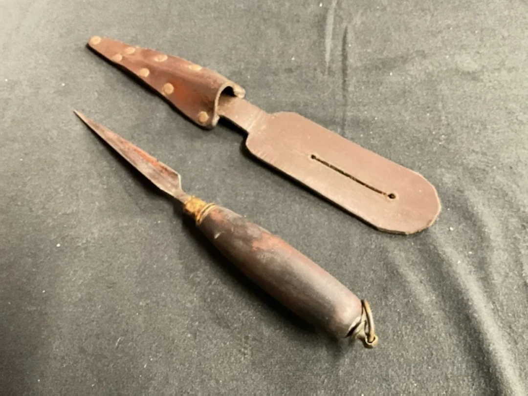 An antique butchers fat testing knife with U-shaped pointed blade