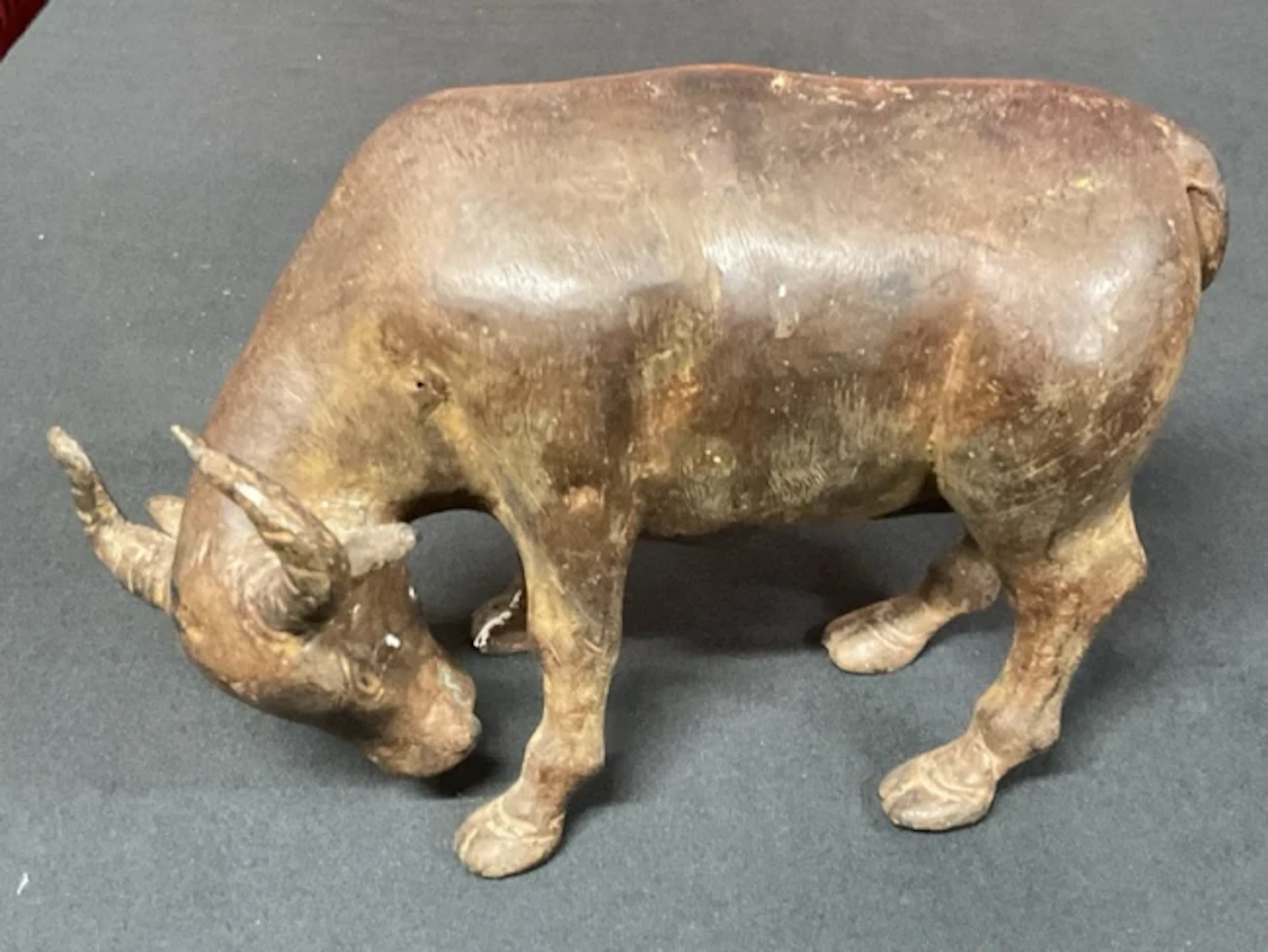 An Indonesian bronze figure of a water buffalo bull with brown patination