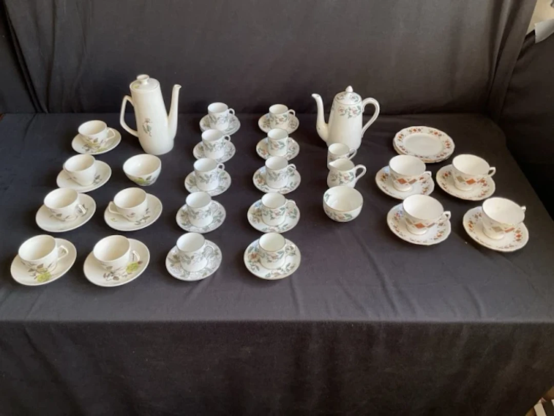A six-piece Empire Porcelain coffee set in the June Mist pattern;