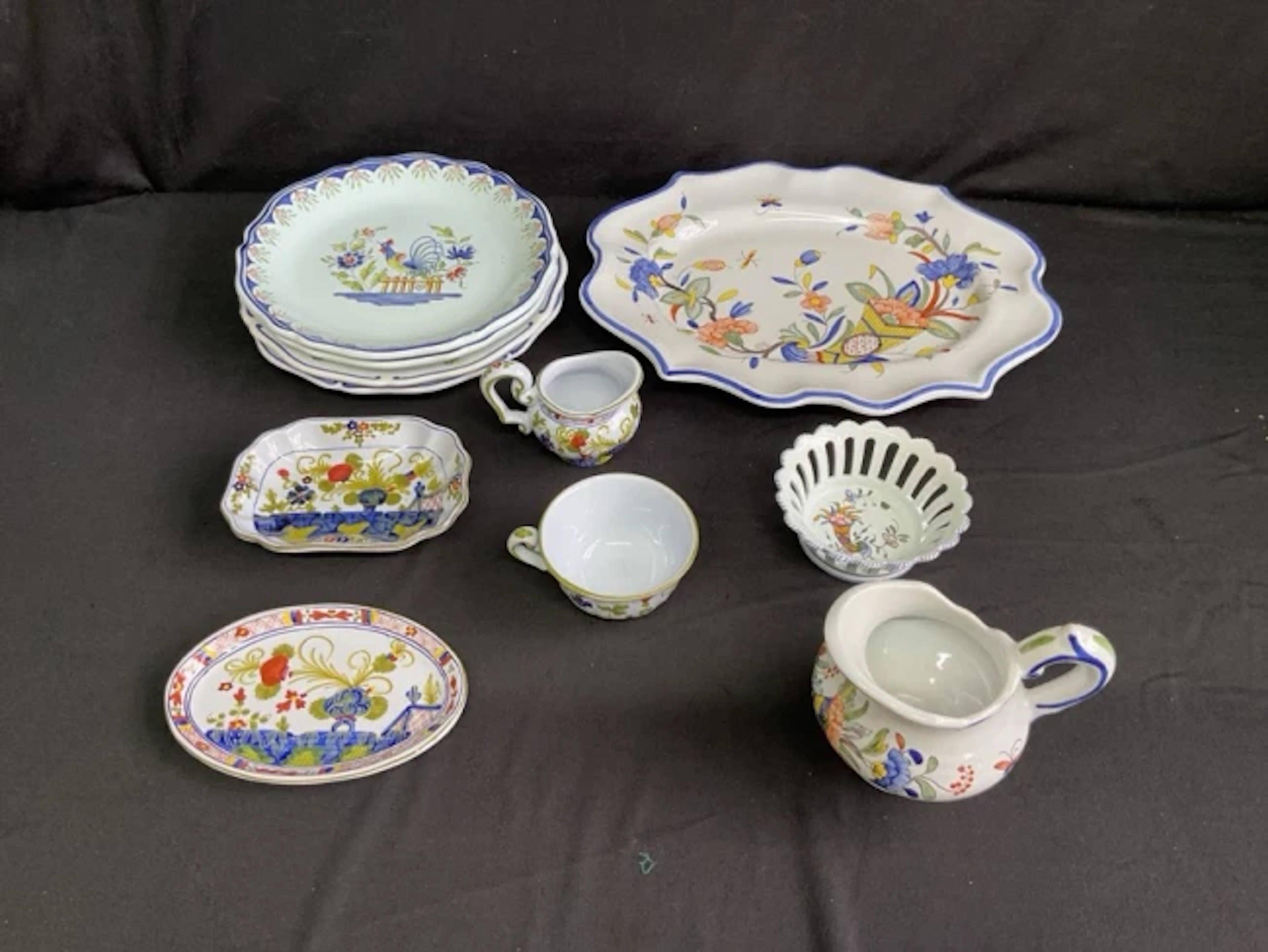 A collection of handpainted French and Italian faience including an
