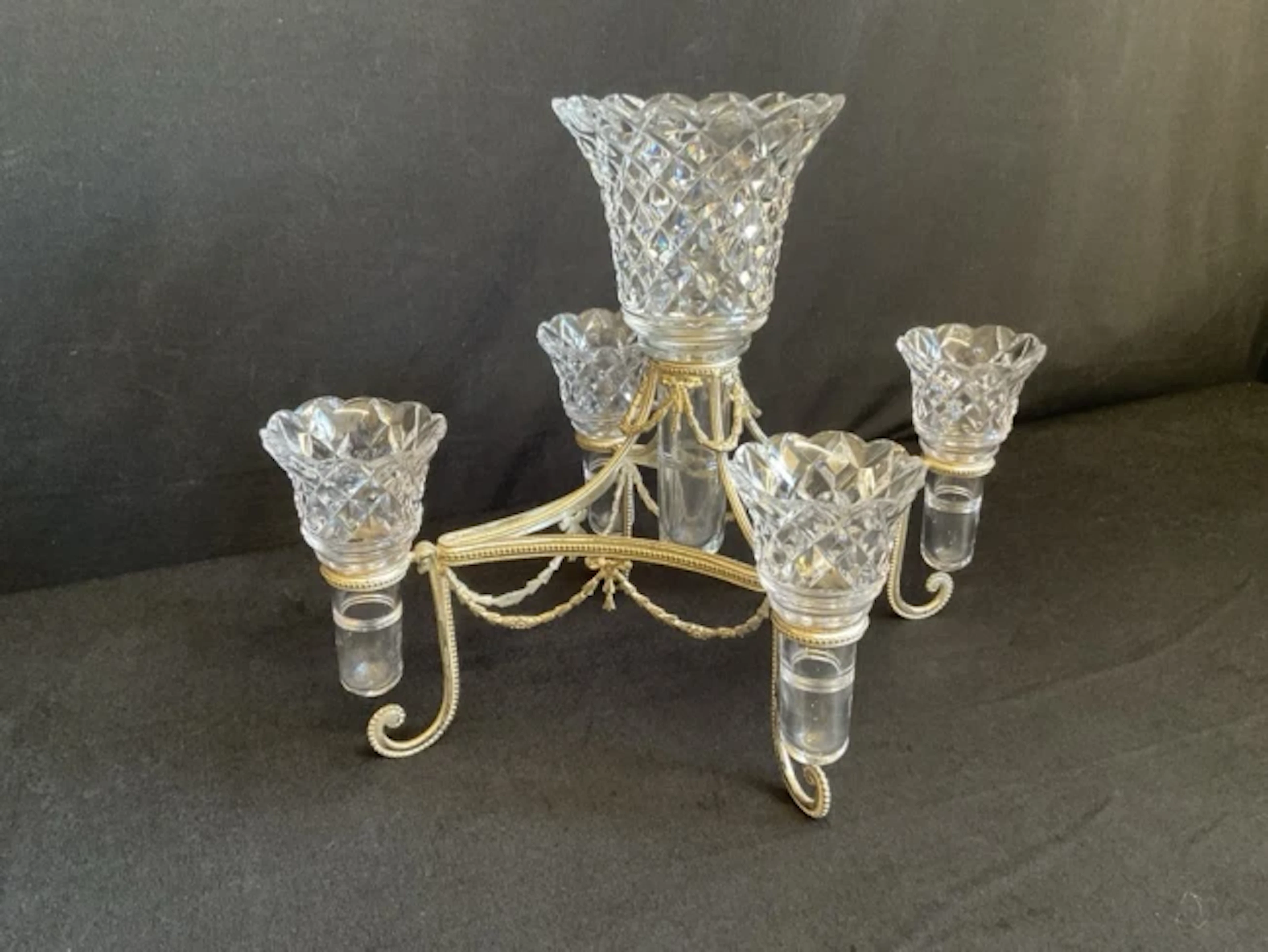 An Edwardian silver plated and cut glass épergne, the concave lozenge
