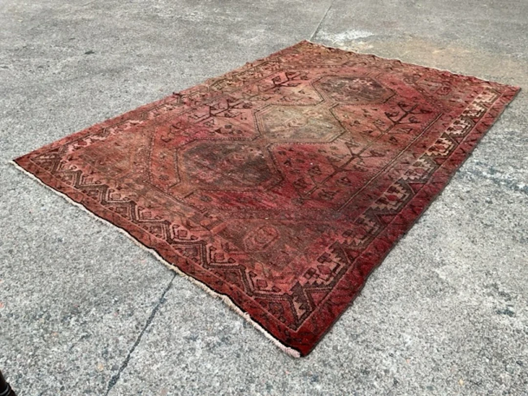 A Qashqai wool carpet woven with three conjoined octagonal medallions