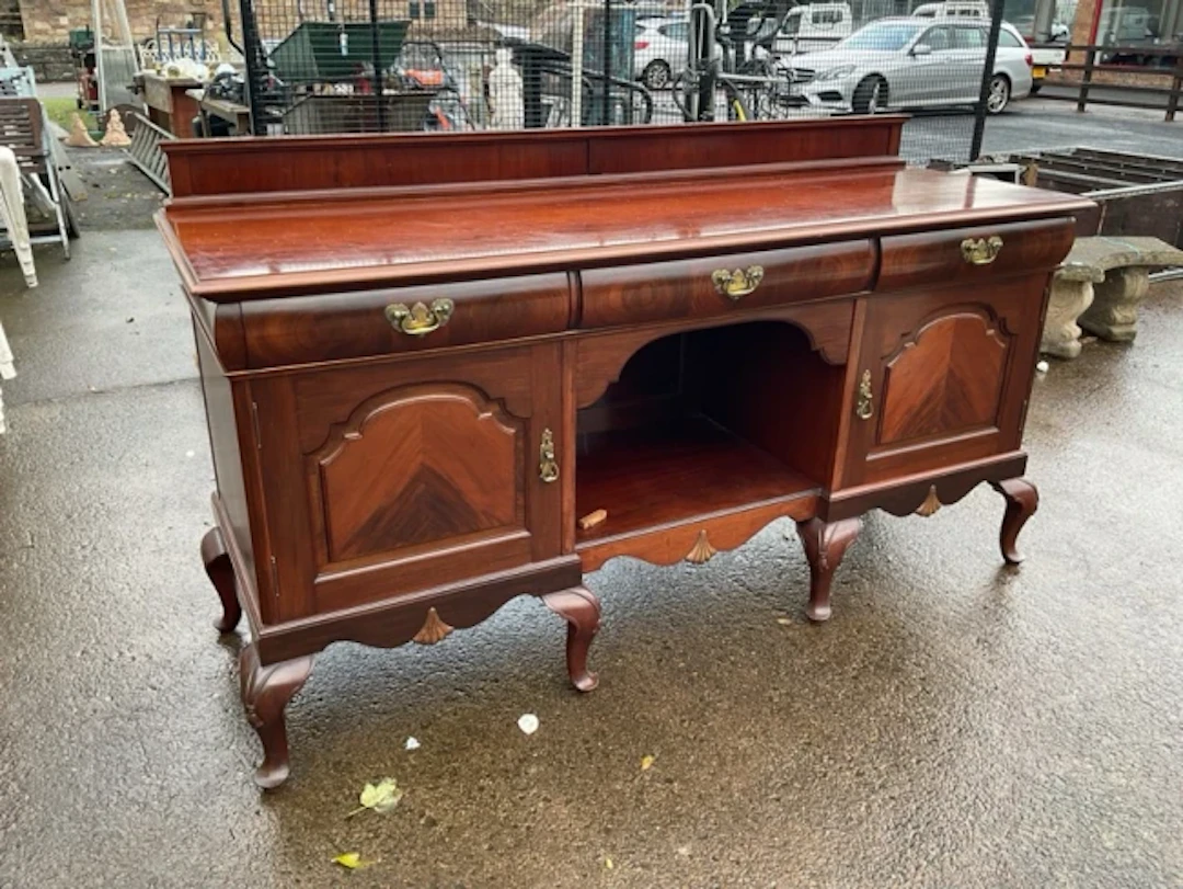 A late Victorian mahogany sideboard with rectangular moulded top above