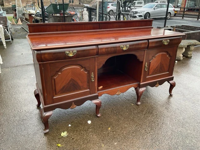 A late Victorian mahogany sideboard with rectangular moulded top above
