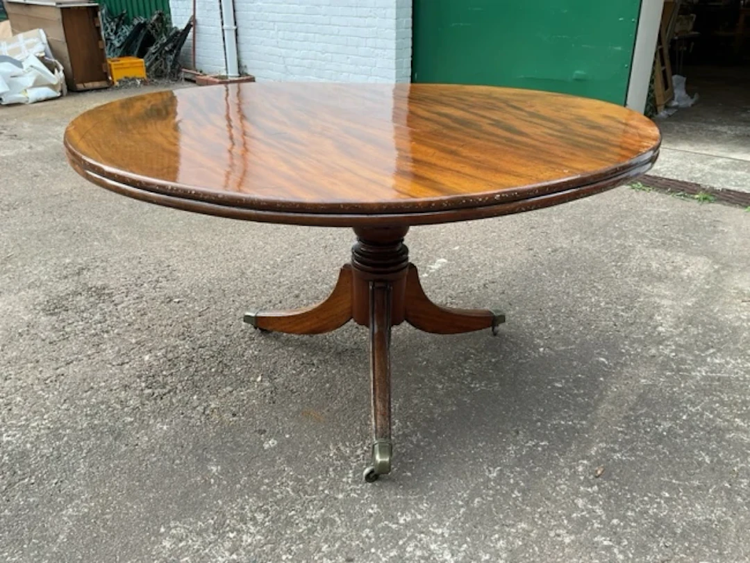 A regency mahogany circular tilt-top breakfast table by McIntosh