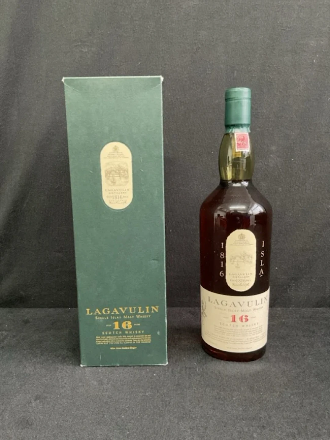 A boxed bottle of Lagavulin 16 year old single Islay malt whisky.