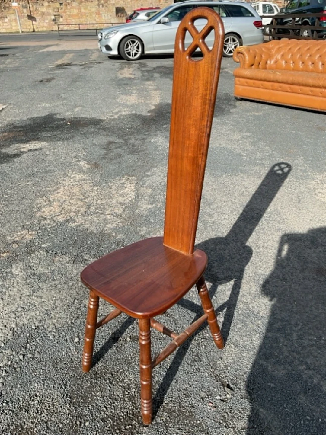 A mahogany spinning chair with high arched splat back pierced with
