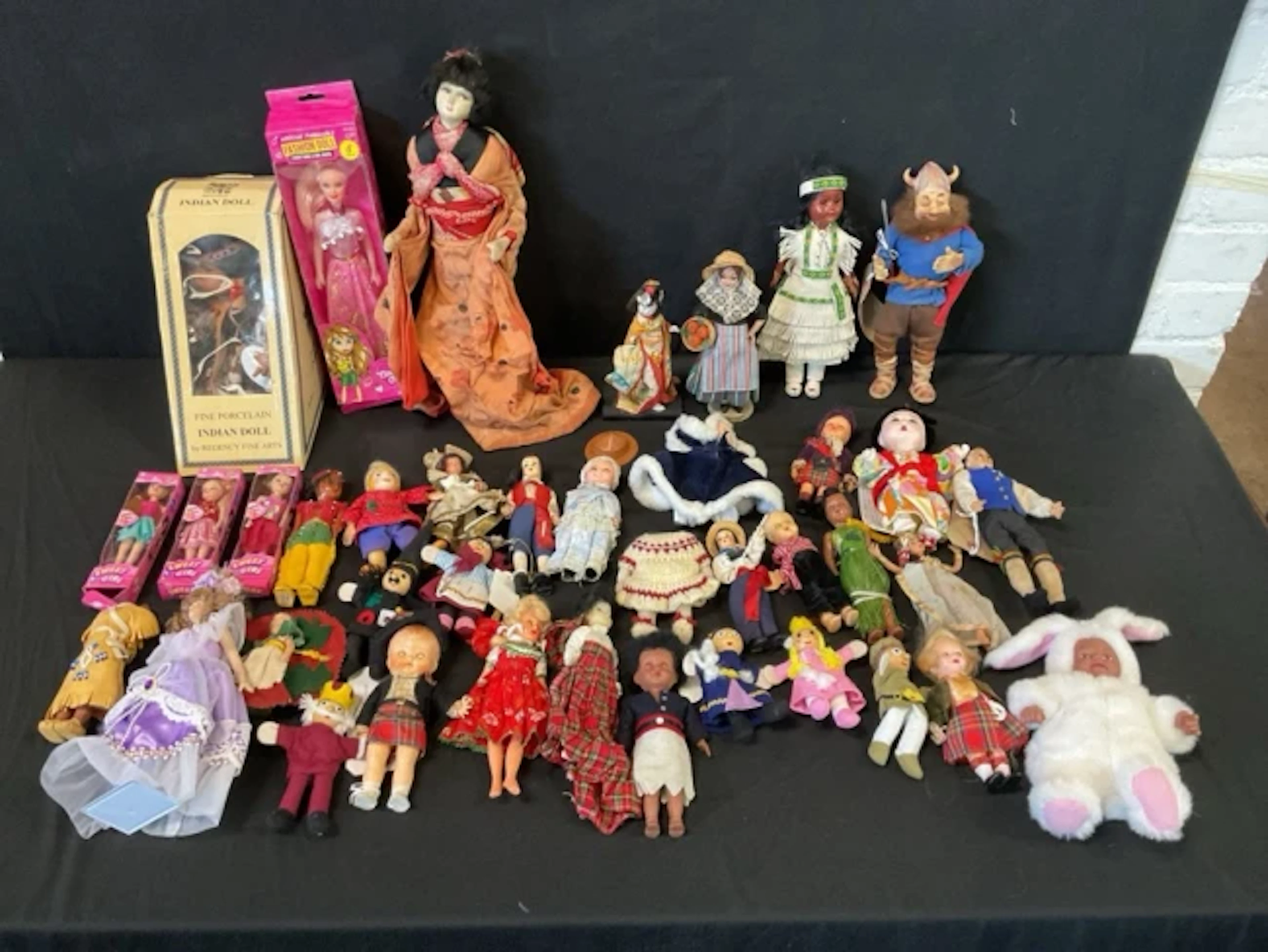A collection of small dolls & figures - Italian, Pedigree, Scottish