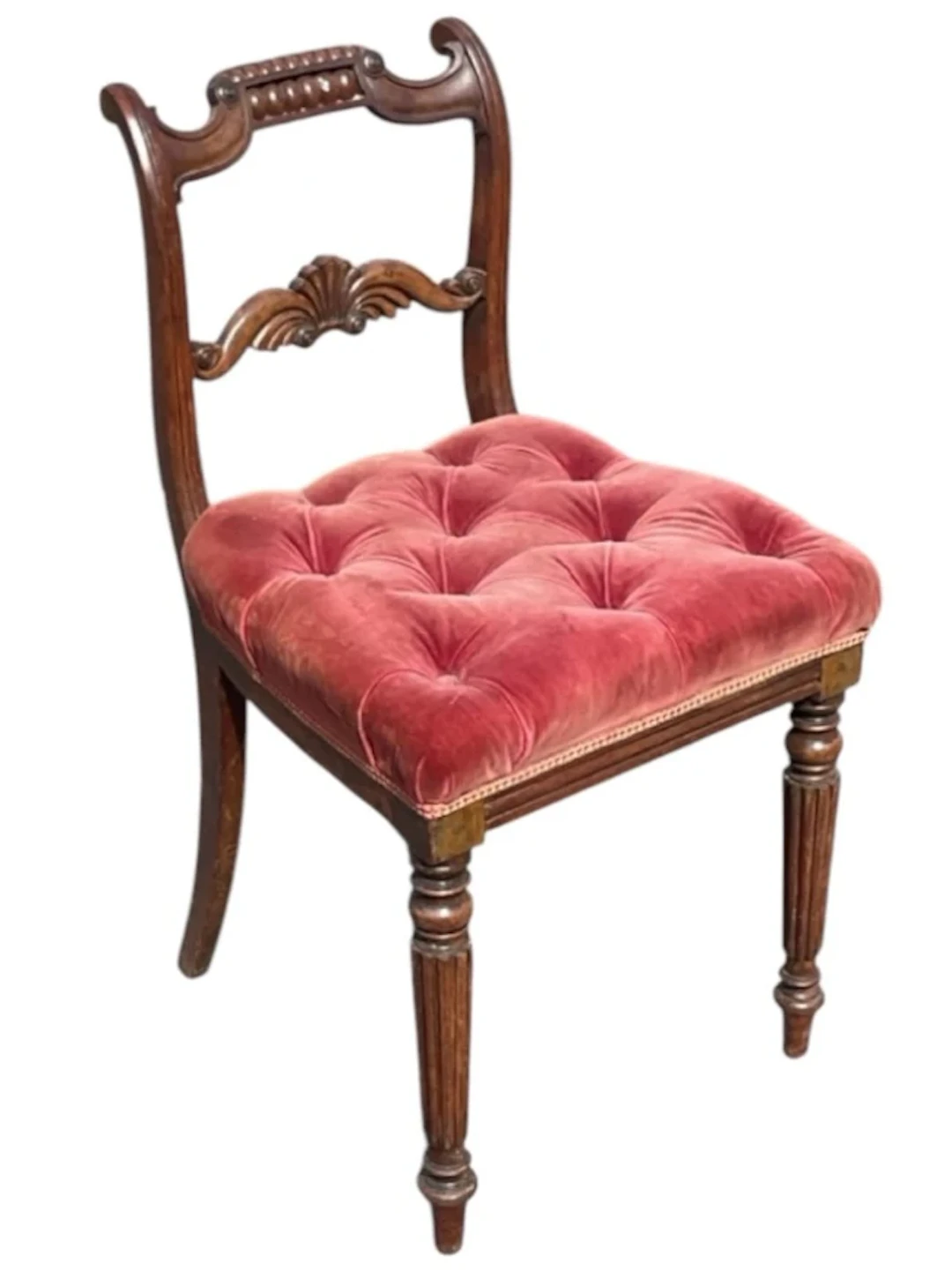 A regency mahogany chair with bead applied scrolled back above shell