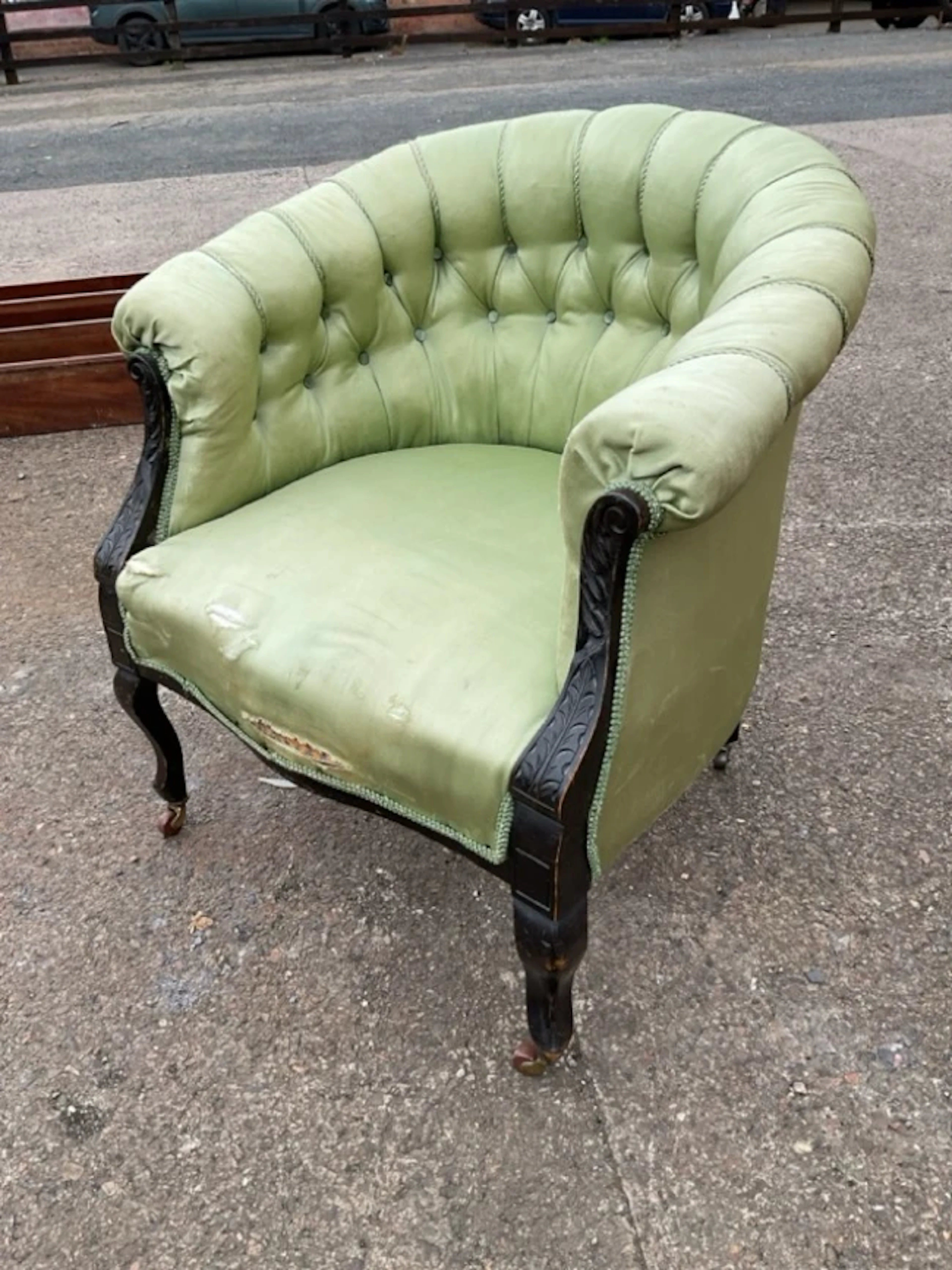 A Victorian mahogany upholstered tub armchair with buttoned horseshoe