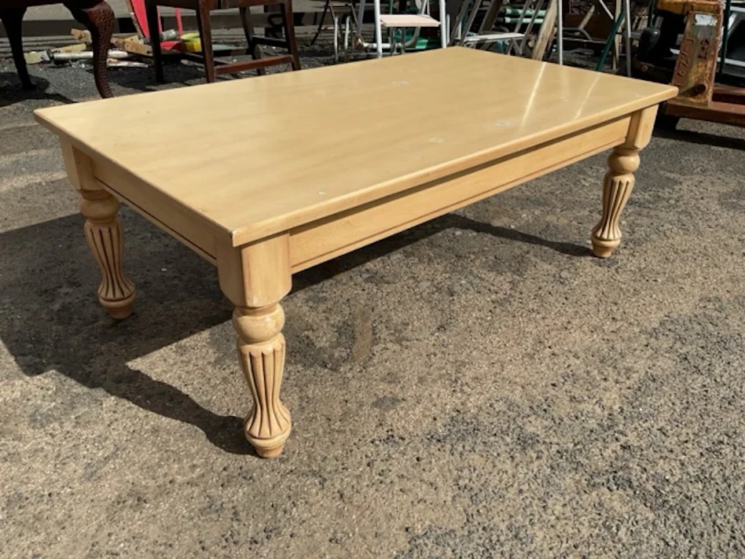 A painted coffee table with rectangular top on waisted turned fluted