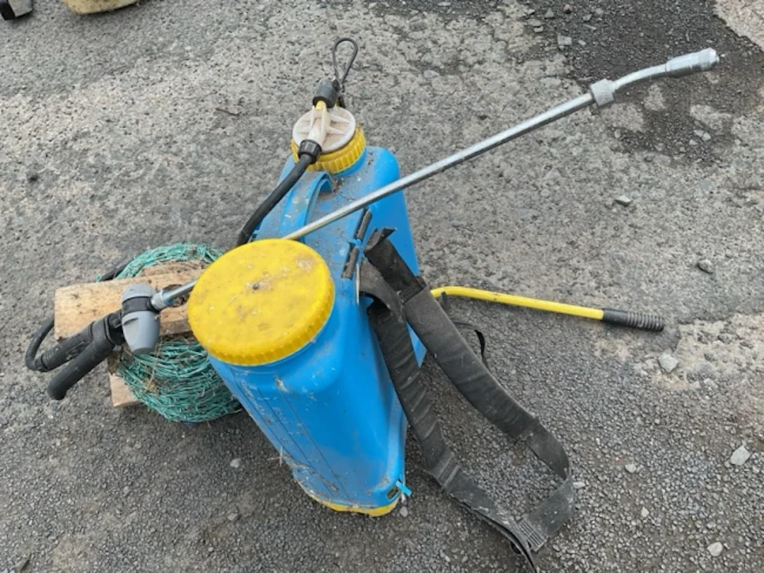 A pump action knapsack sprayer with tank, lance, straps, etc; and