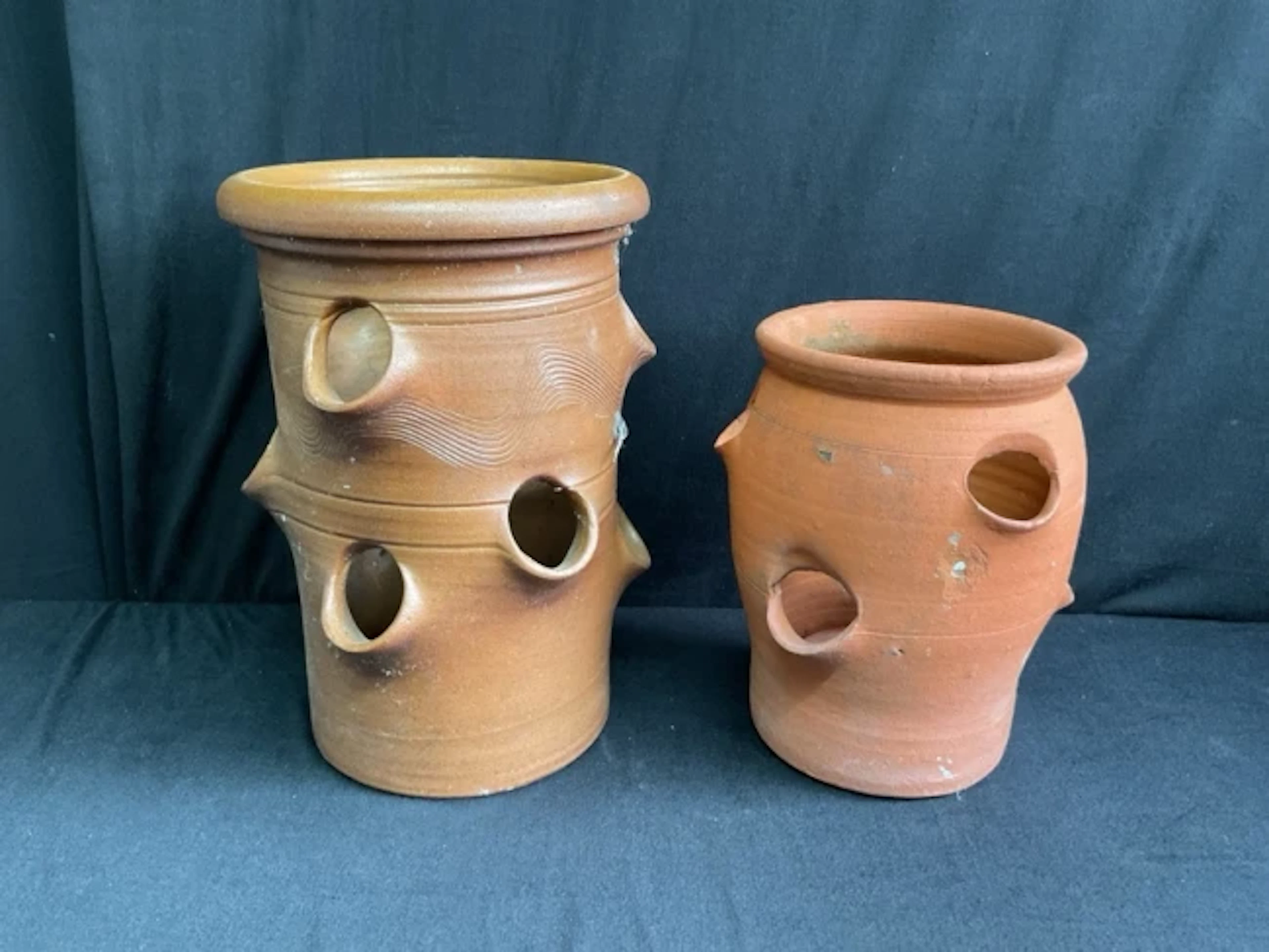 An Errington Reay saltglazed stoneware nine-hole strawberry planter