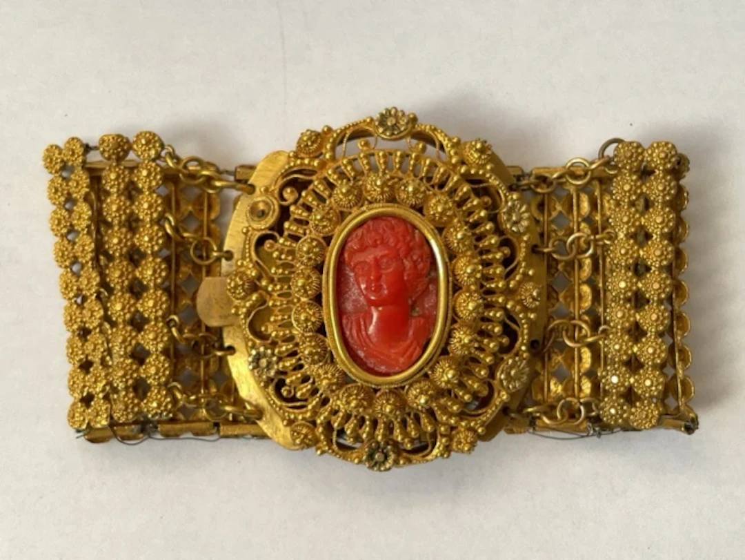 An antique cameo bracelet, the central coral portrait set in tiered