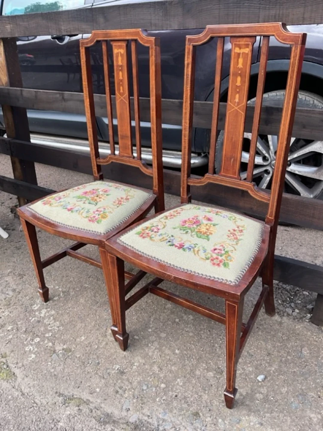 A pair of Edwardian mahogany chairs inlaid with boxwood stringing