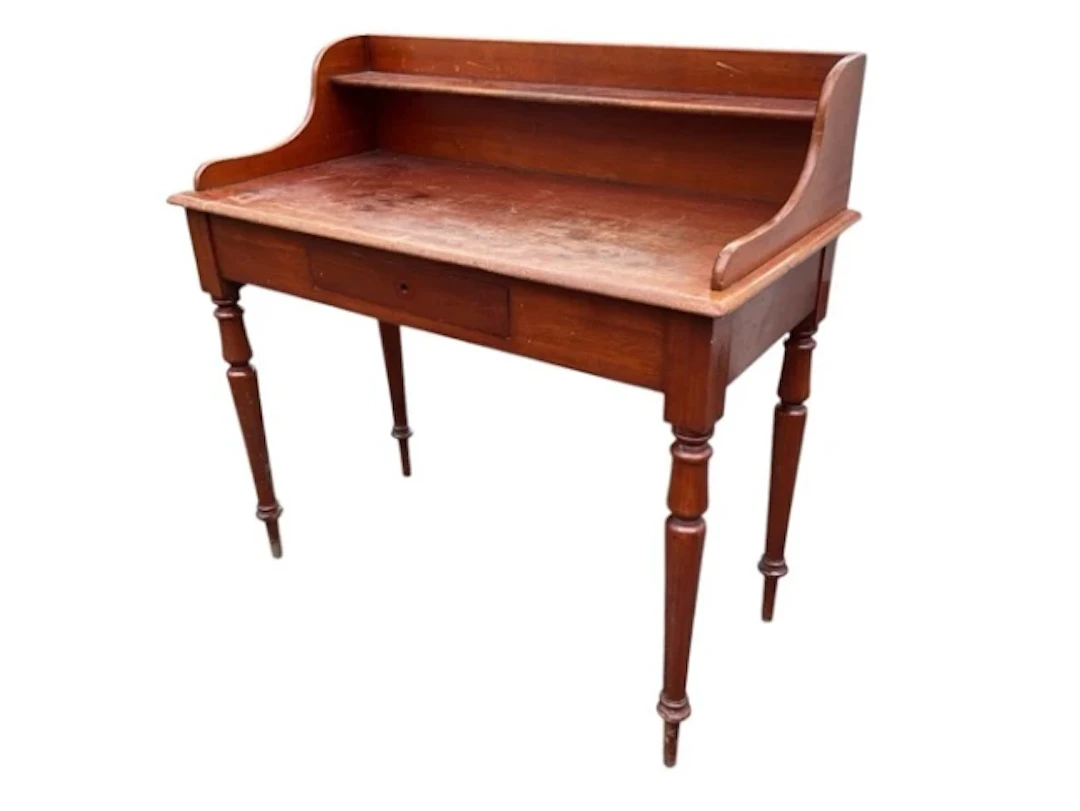 A Victorian mahogany washstand, the raised back and sides with a shelf