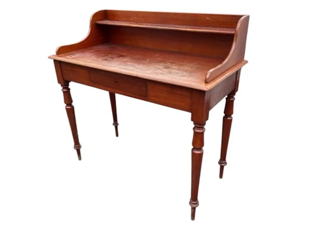 A Victorian mahogany washstand, the raised back and sides with a shelf