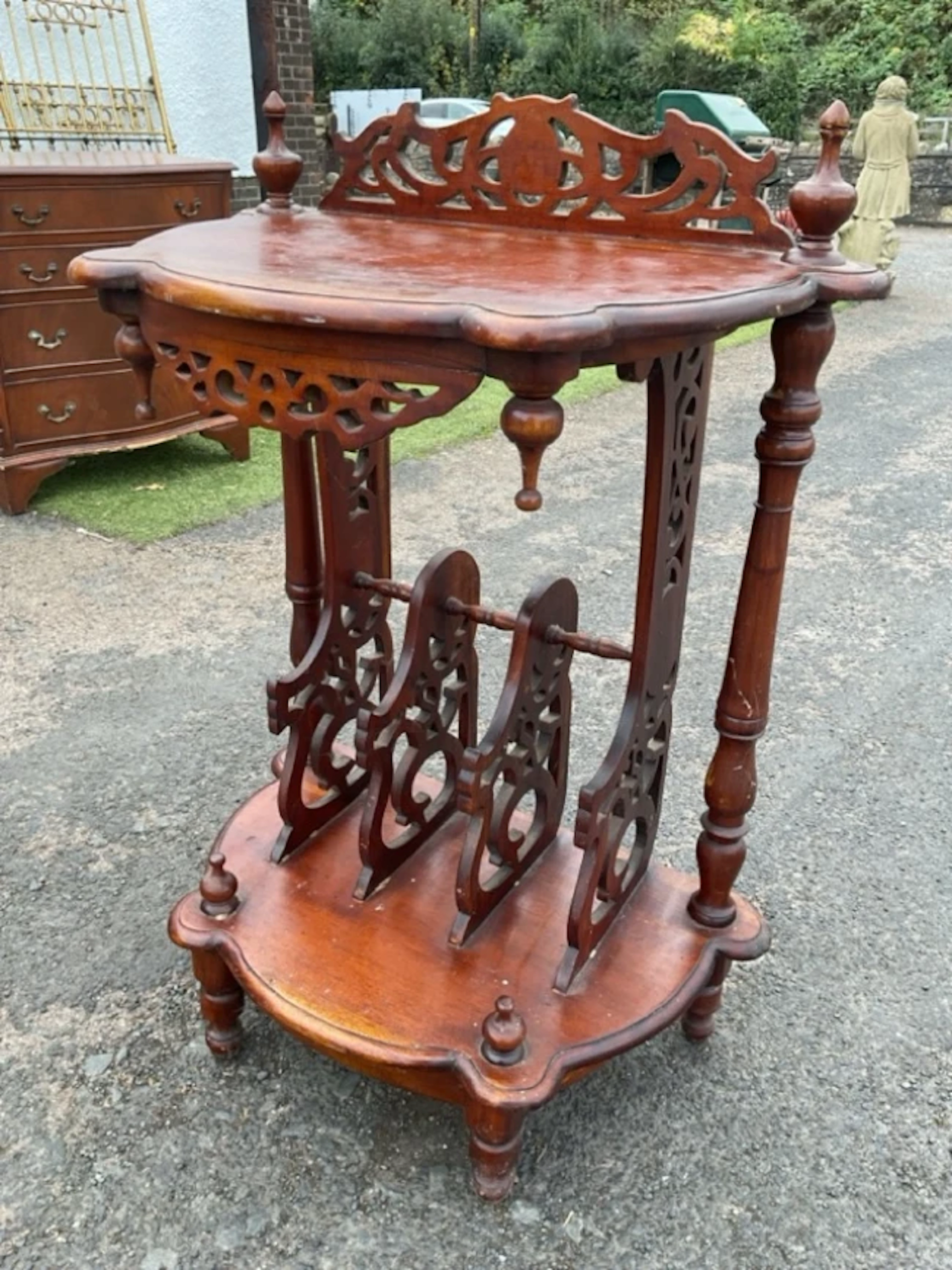 A Victorian style mahogany canterbury with fretwork back and scalloped