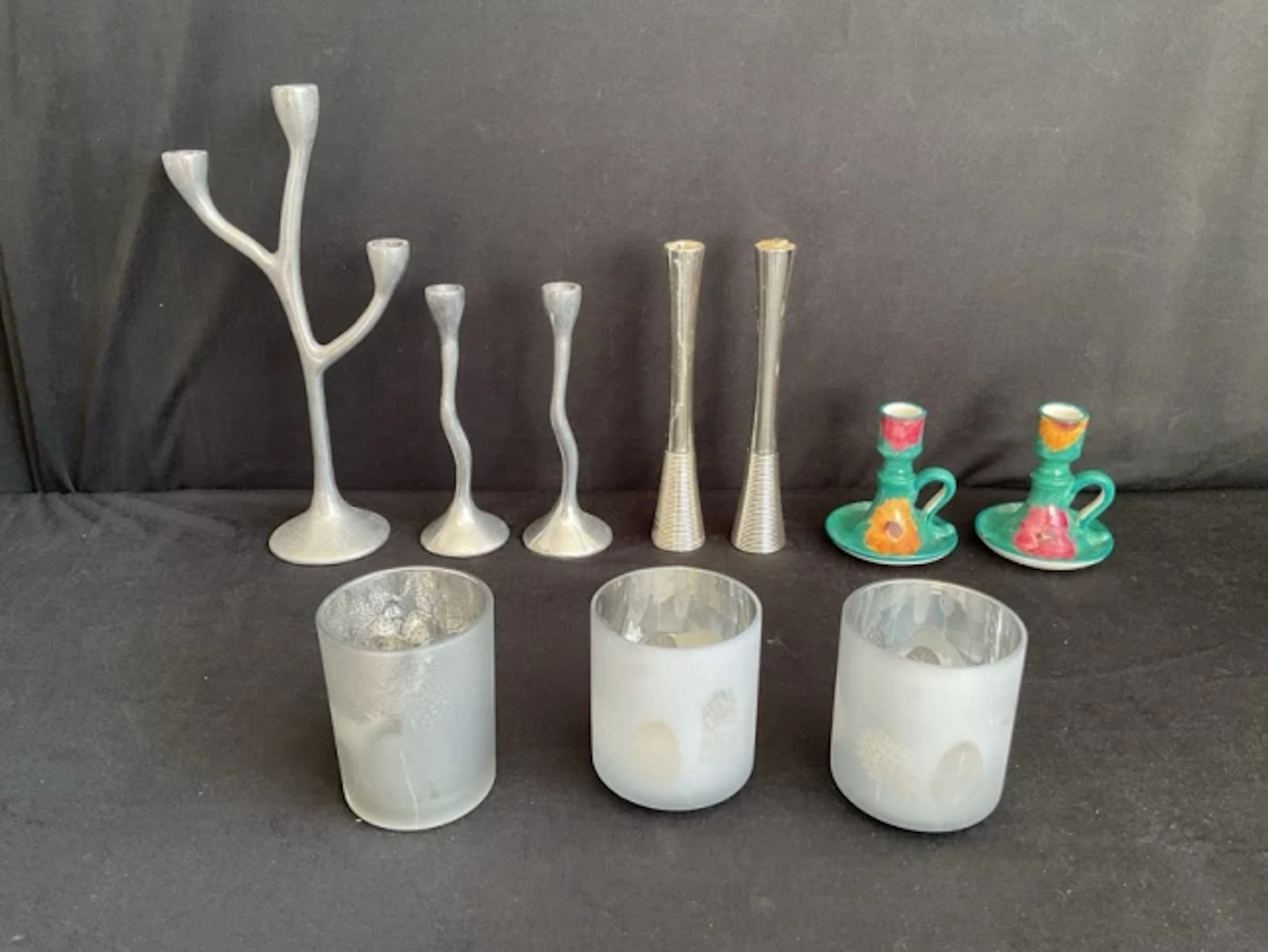 A cast aluminium candelabra in the form of a stylised tree with matching