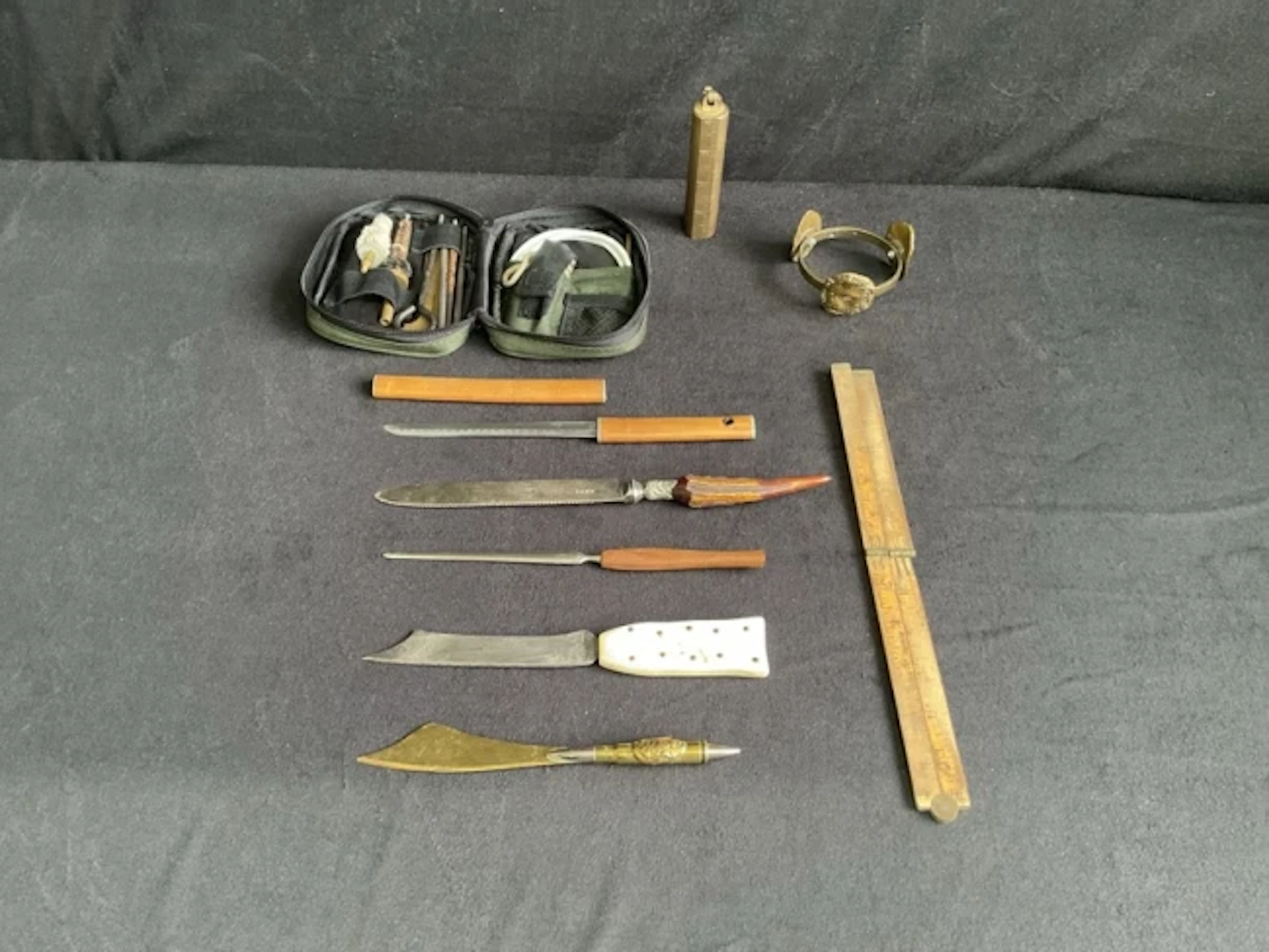 A 223 gin cleaning kit in nylon pouch, a brass tank dipping weight