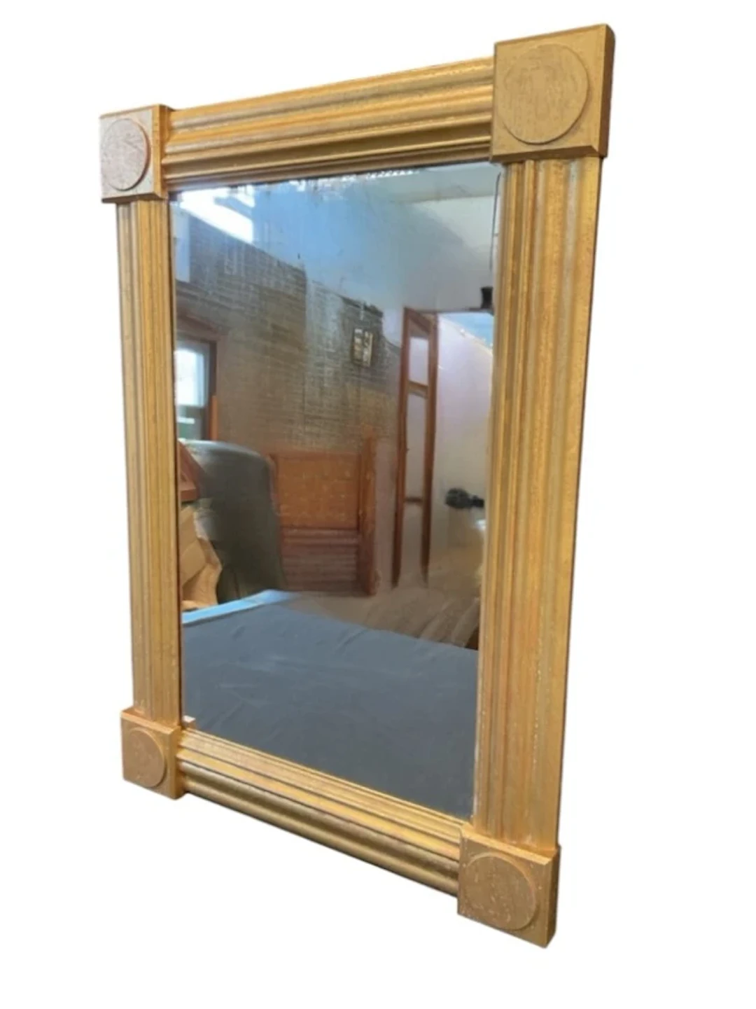 A rectangular giltwood deco style mirror, the moulded frame with roundel