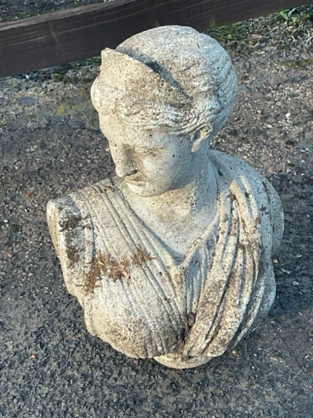 A composition stone bust of a classical cloaked tiara wearing lady. (17in)