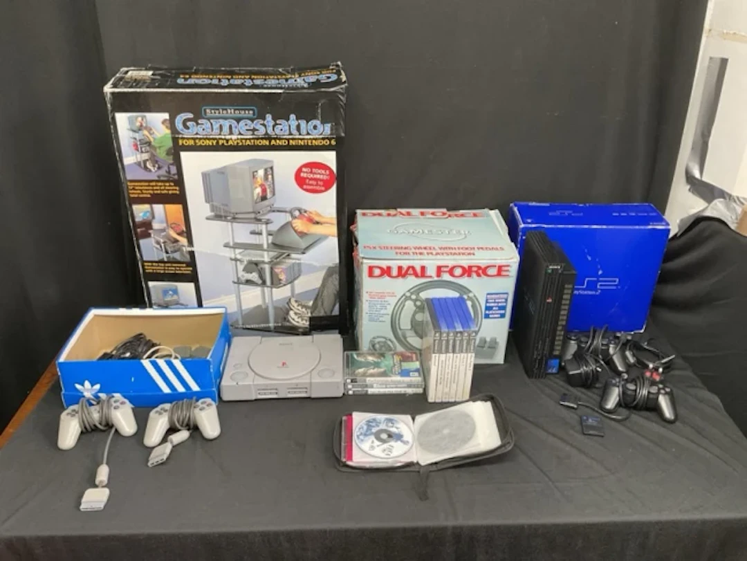 A Sony PlayStation PS1, a boxed PS2, a boxed Style House Game Starion