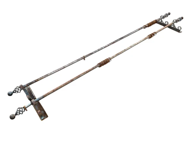 A pair of blacksmith made wrought iron curtain poles complete with