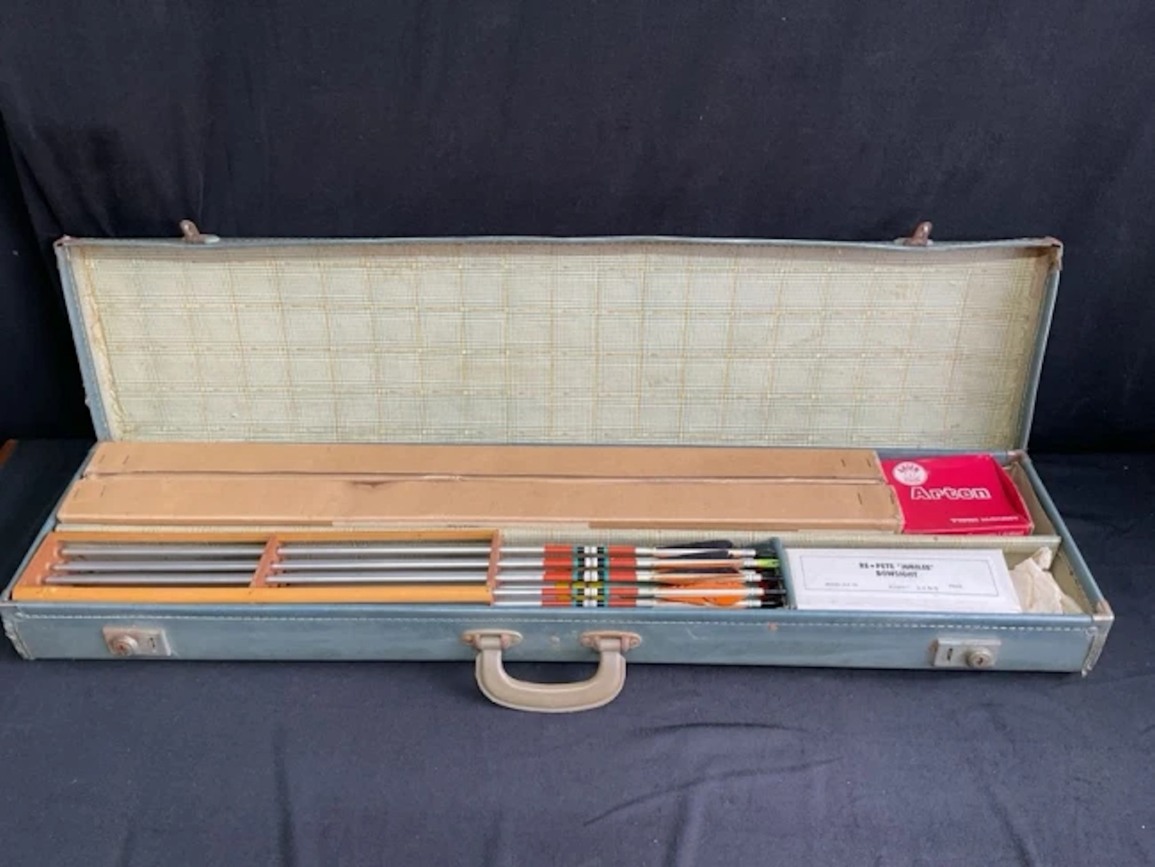 An archers fibreboard arrow case containing boxed Practistreak and