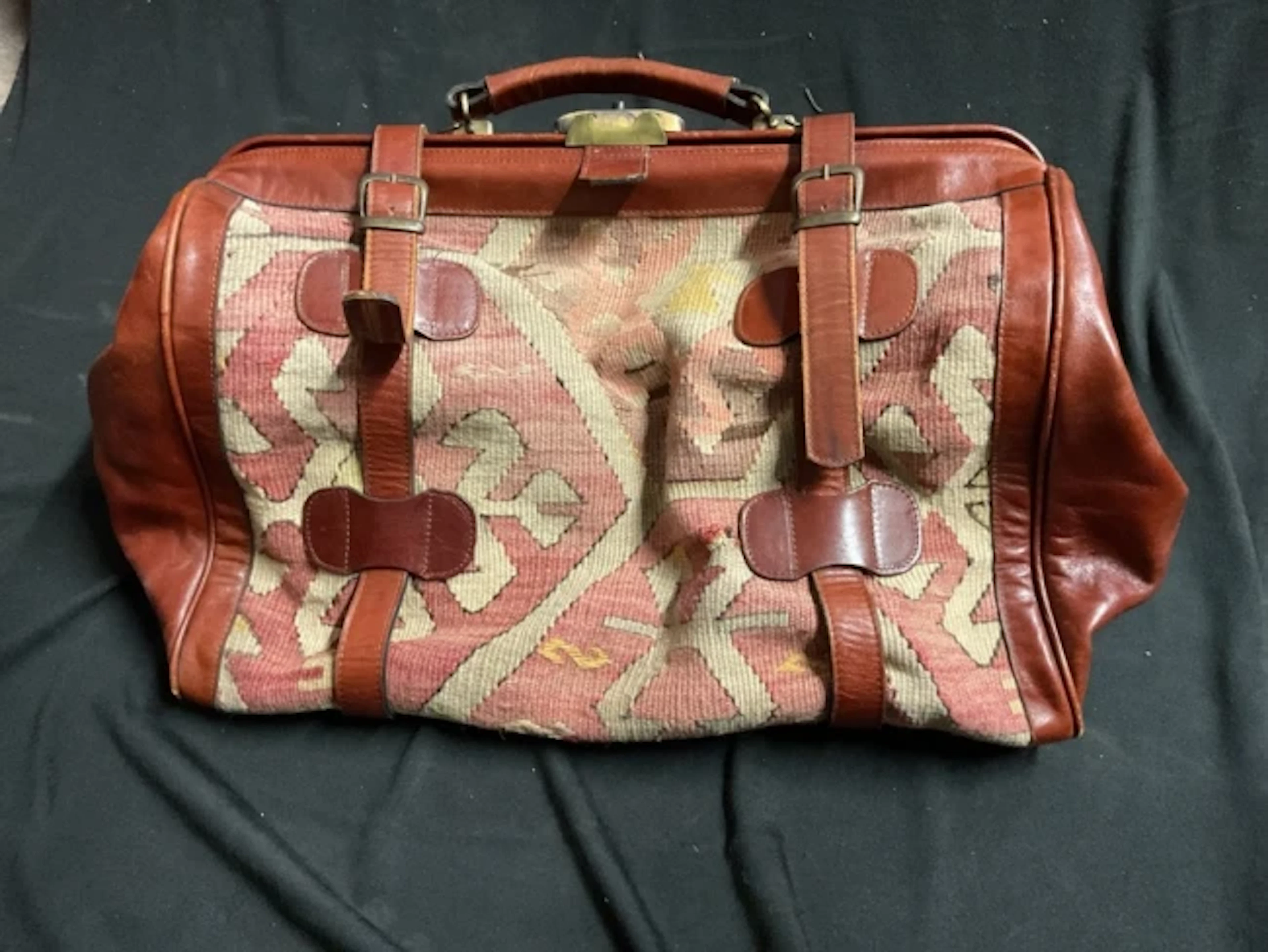 A Turkish kilim and leather Gladstone style overnight carpet bag with