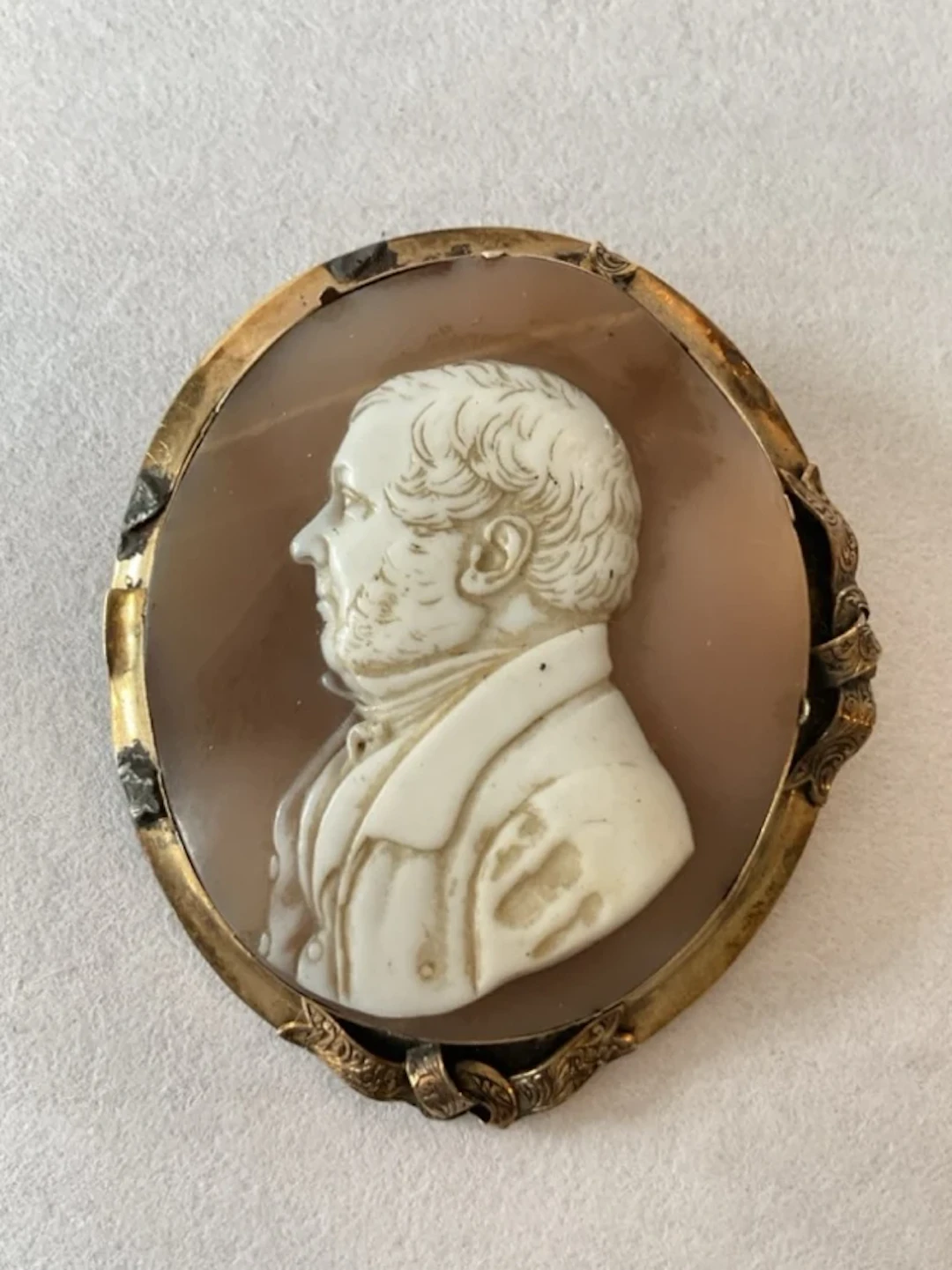A Victorian shell cameo brooch of a gentleman in profile signed IN