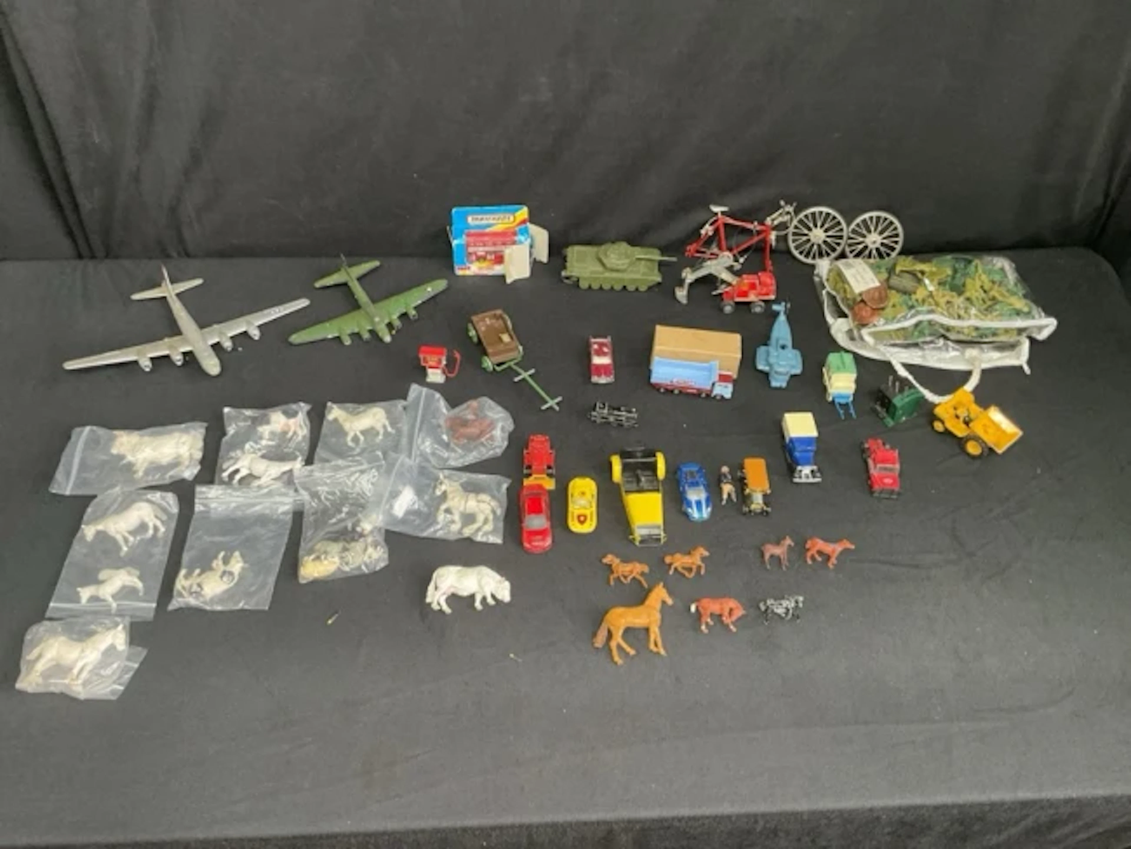 Miscellaneous diecast models including planes, a tank, trucks, vans