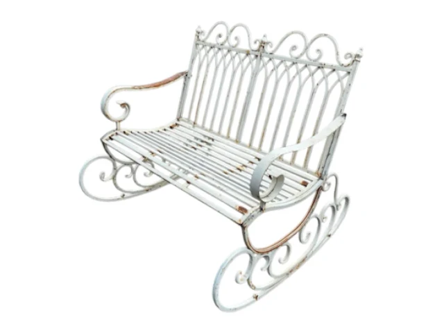 A painted wrought iron garden rocking chair bench with pierced gothic