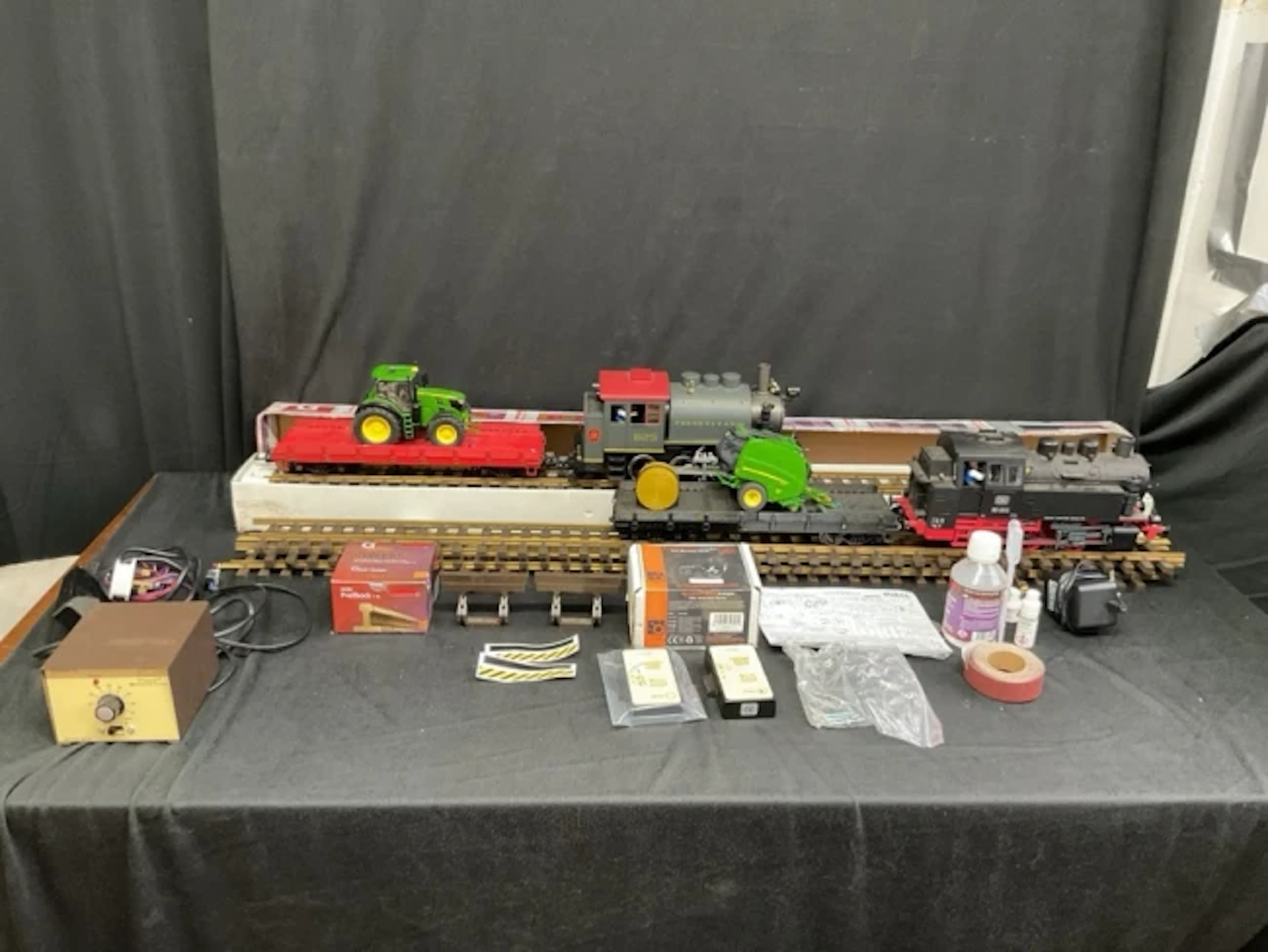 A collection of G-gauge model railway rolling stock and accessories