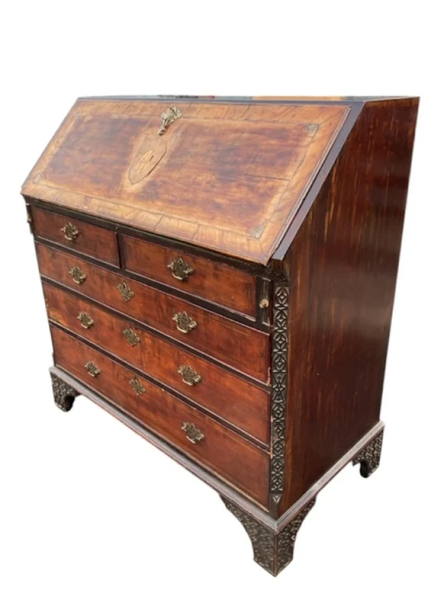 A Georgian mahogany bureau with sloped crossbanded front inlaid with