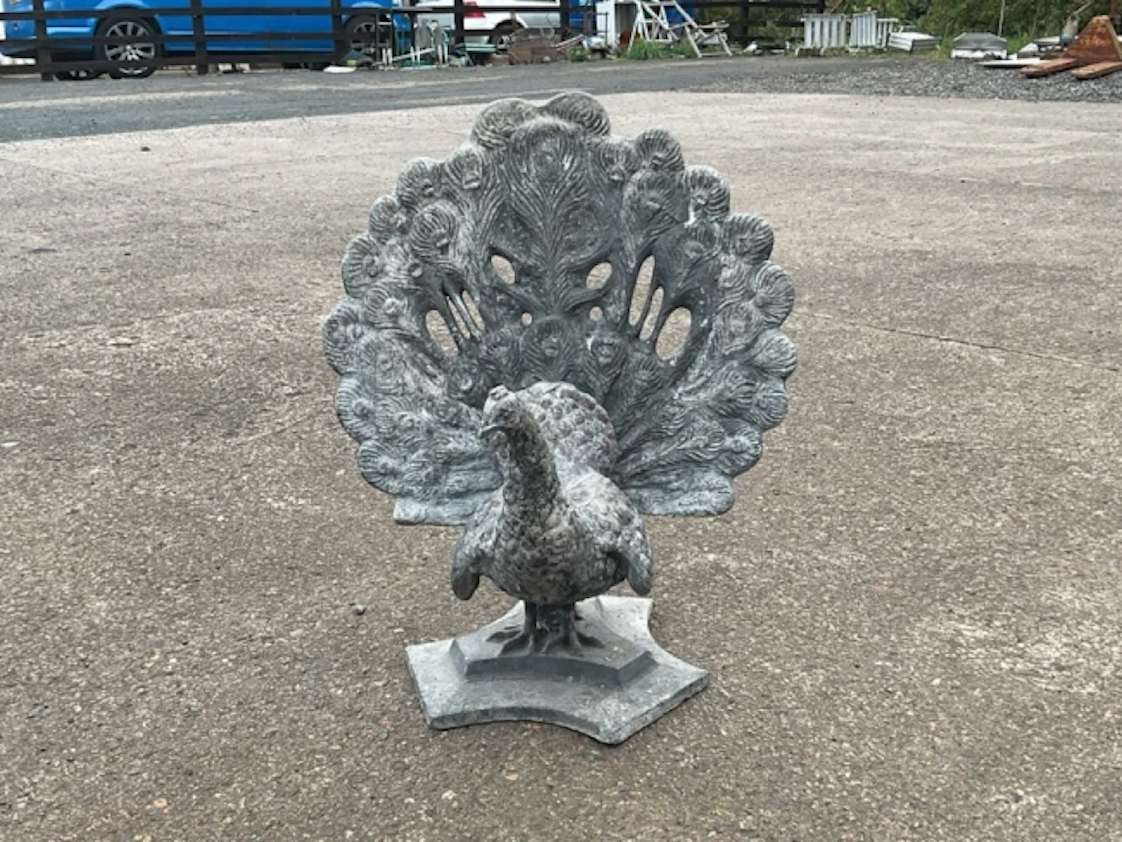A pair of English lead peacocks, the finely modelled birds with detachable