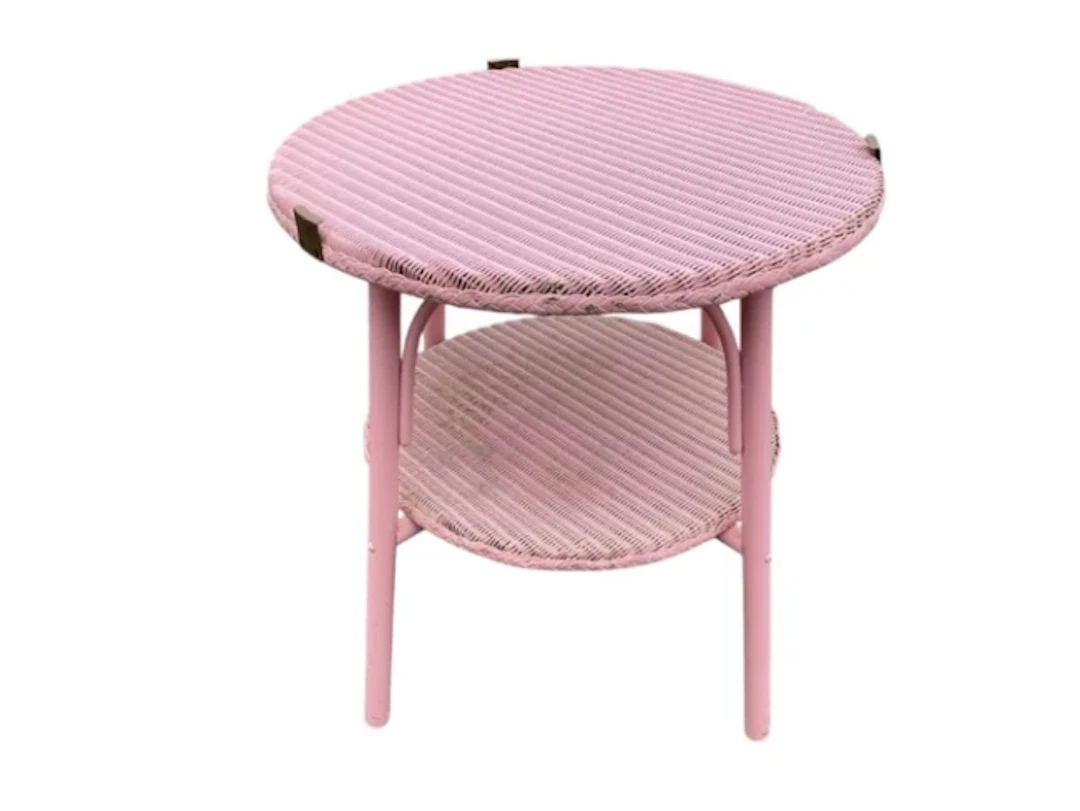 A painted circular Lloyd Loom style coffee table, formerly having
