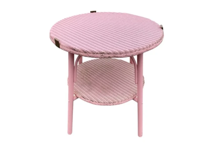 A painted circular Lloyd Loom style coffee table, formerly having