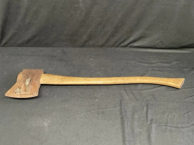 A cast iron 7lb splitting axe on a hickory handle. (30in)