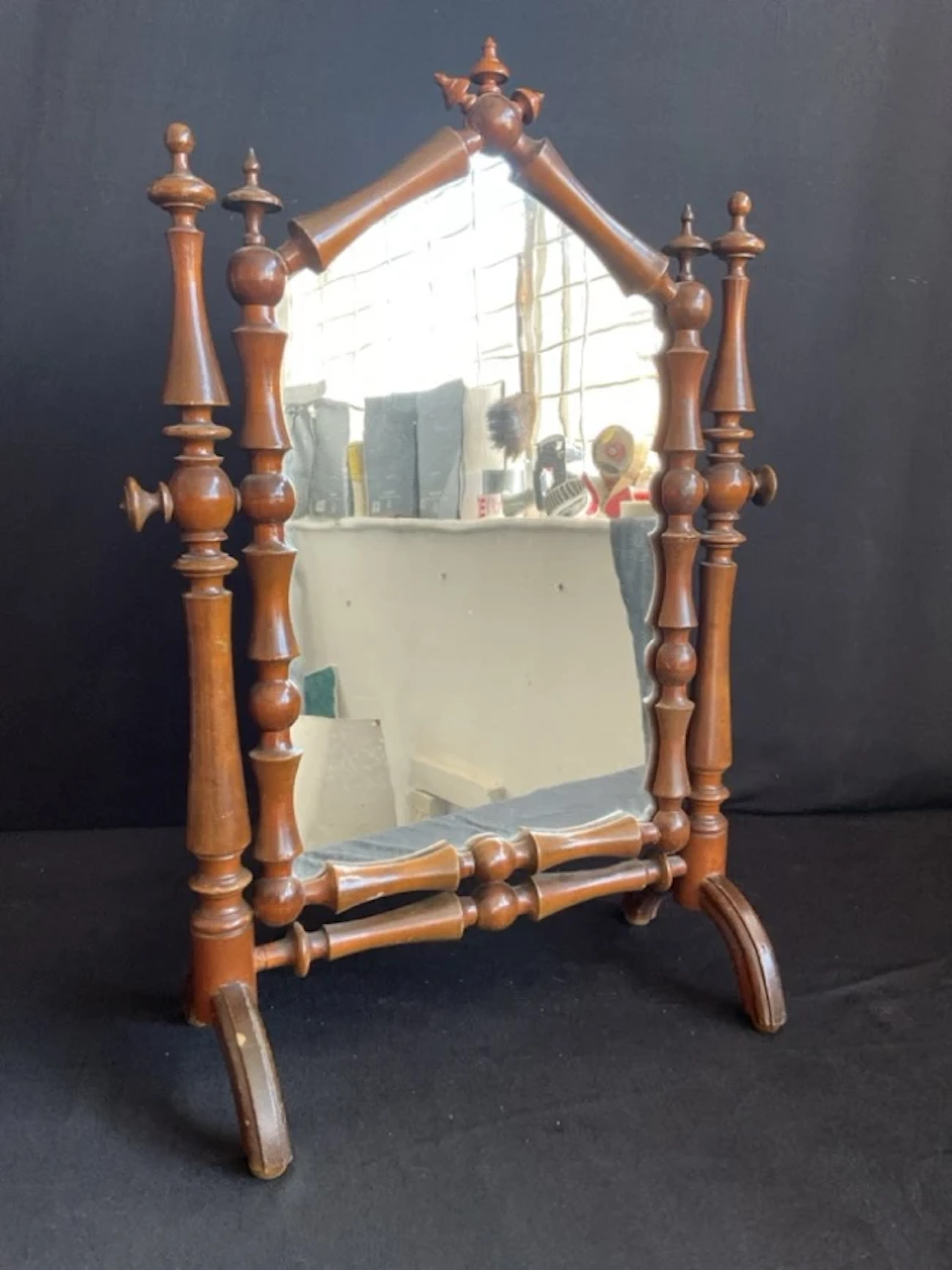 A dressing table mirror formed from baluster turnings with finials