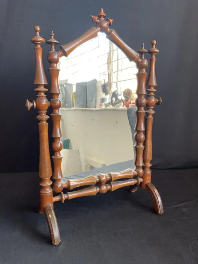 A dressing table mirror formed from baluster turnings with finials