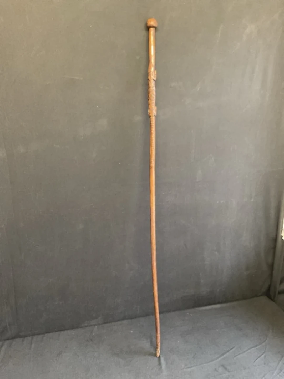 An African hardwood tribal elders staff with ball finial in a tapering