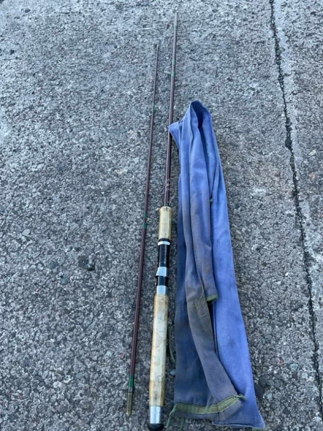 A sleeved Greys of Alnwick 7ft two-piece fibre spinning rod with cork