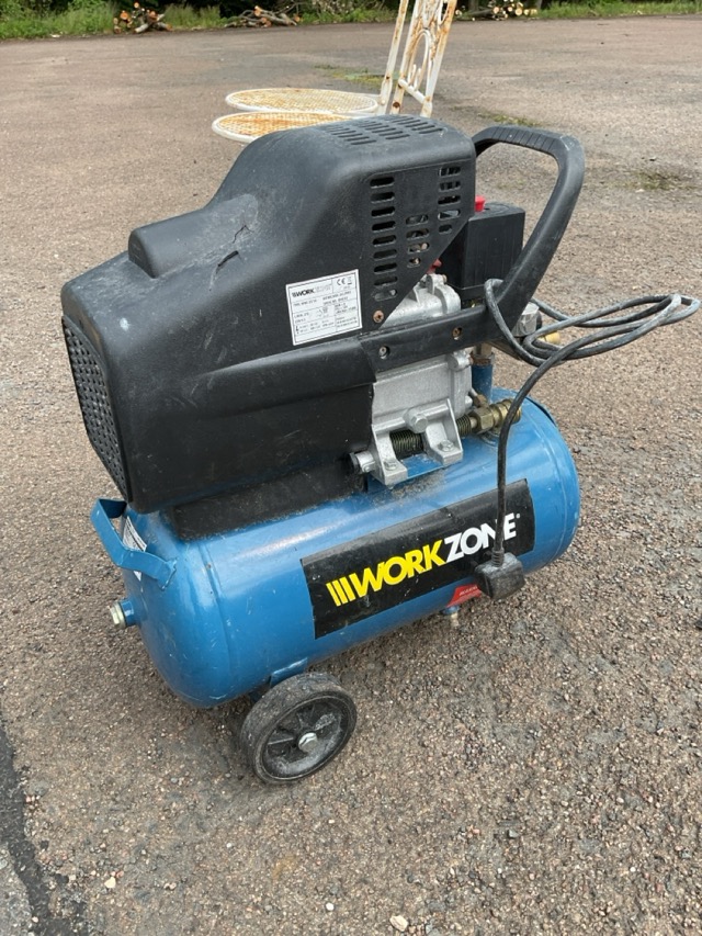 A Workzone compressor with electric motor above tank on trolley stand ...