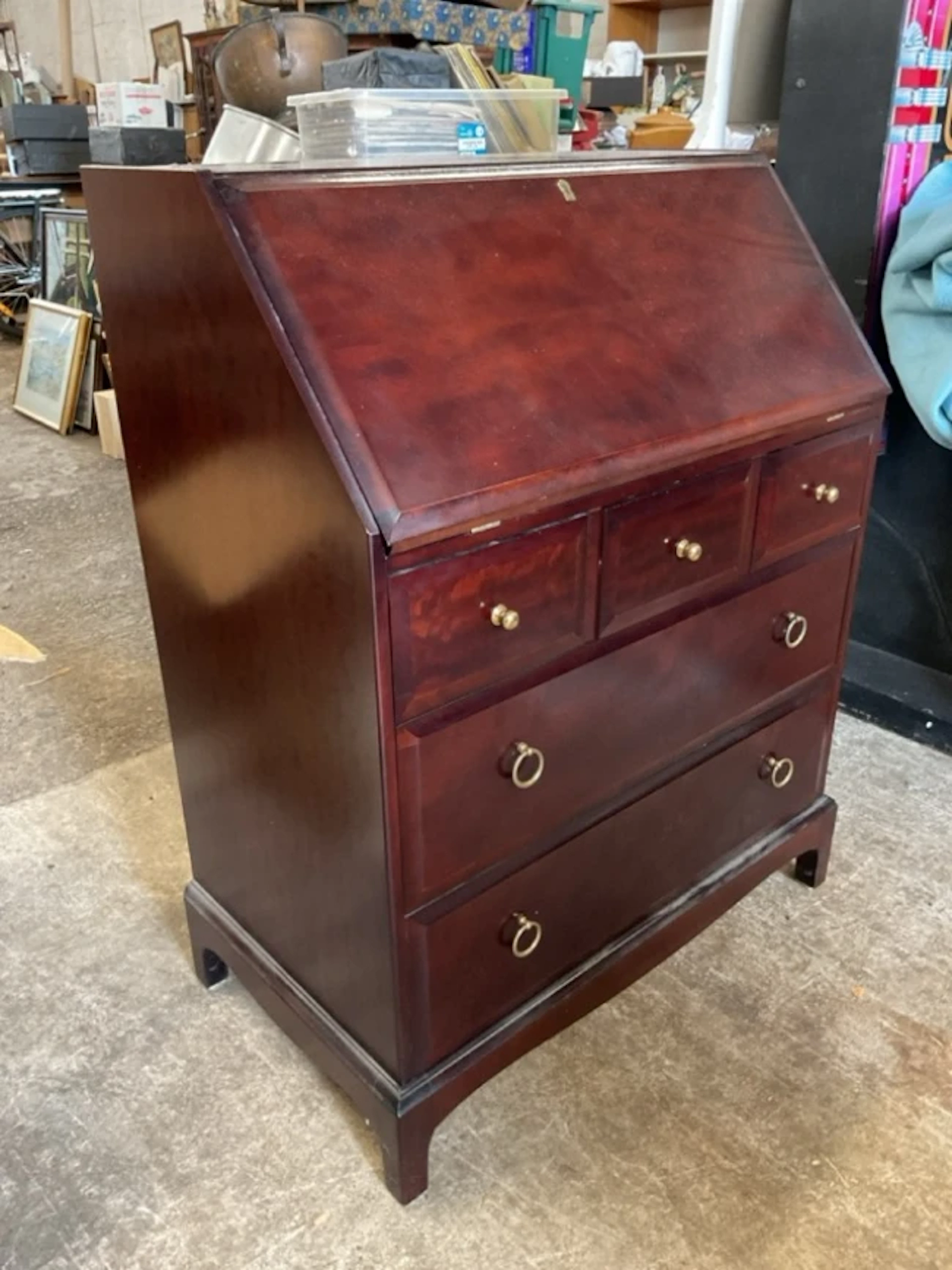 A Stag bureau with moulded fallfront enclosing a fitted intetior with